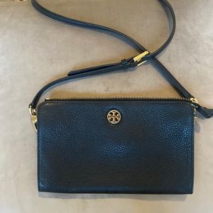 Black Tory Burch cross body purse or clutch w/ adjustable and removable strap.